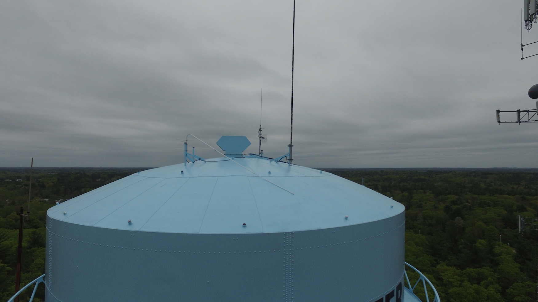 Top of the tank in May 2018.  Our best antenna was snapped at the base and laying over